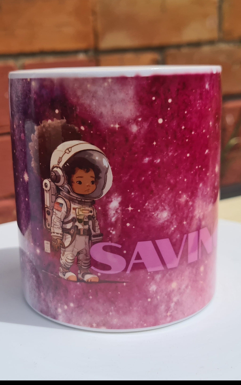 A customised money box space scene with girly astronought