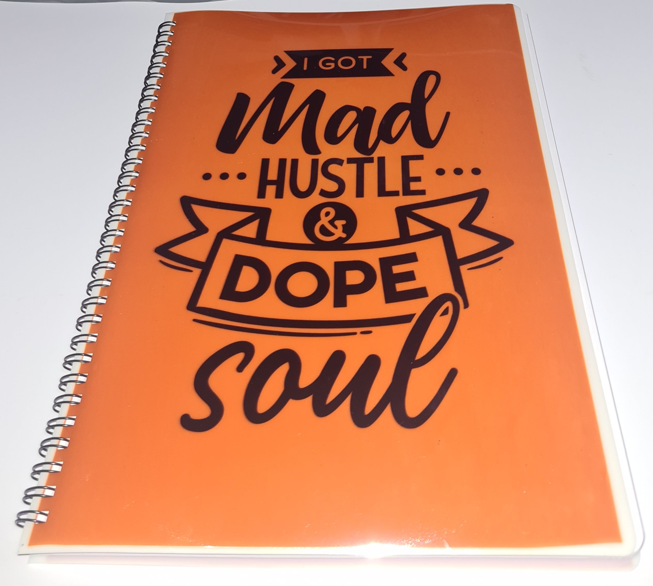Bronze notebook with black text on a white background