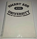 Notebook with 'Smart Ass University' text on a white background